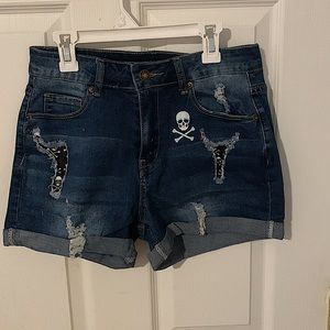 NWOT, Denim shorts, skulls on back pocket & ain front. size small but run big.
